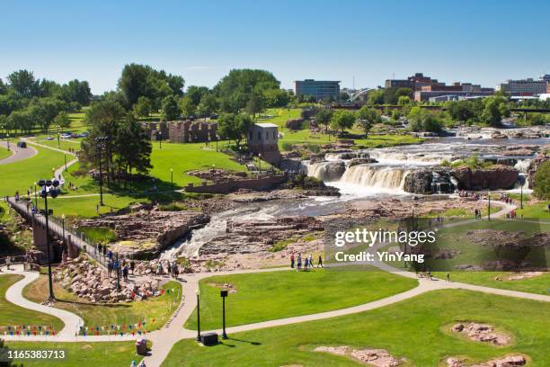 tourists in visitors information center in falls park waterfall in sioux falls, south dakota, usa - sioux falls stock pictures, royalty-free photos & images