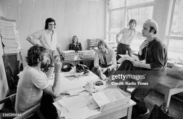 Writers Ian MacNaughton, Terry Jones, unknown, Graham Chapman, Michael Palin and Neil Innes in a script conference for BBC television show 'Monty...