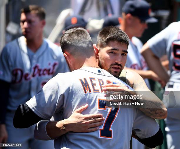 Nicholas Castellanos says goodbye to Jordy Mercer of the Detroit Tigers in the dugout after being traded to the Chicago Cubs during the first inning...