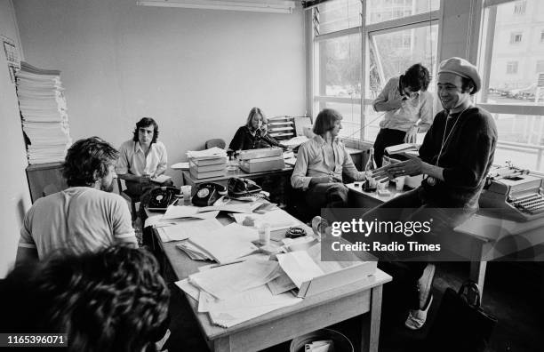 Writers Ian MacNaughton, Terry Jones, unknown, Graham Chapman, Michael Palin and Neil Innes in a script conference for BBC television show 'Monty...