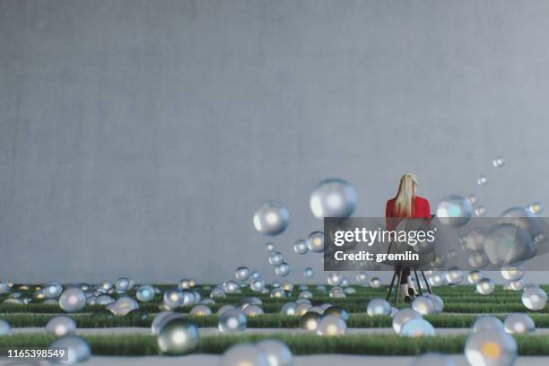 lone businesswoman in the grass office - balls bouncing stock pictures, royalty-free photos & images