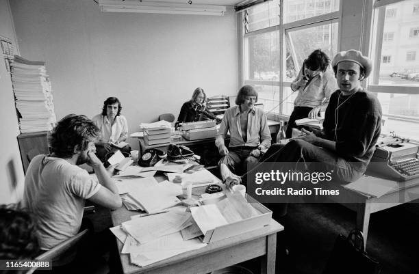 Writers Ian MacNaughton, Terry Jones, unknown, Graham Chapman, Michael Palin and Neil Innes in a script conference for BBC television show 'Monty...