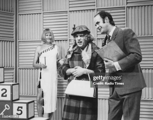 Comedians Graham Chapman, Terry Jones and John Cleese in the 'Take Your Pick' sketch from series 2 of the BBC television show 'Monty Python's Flying...