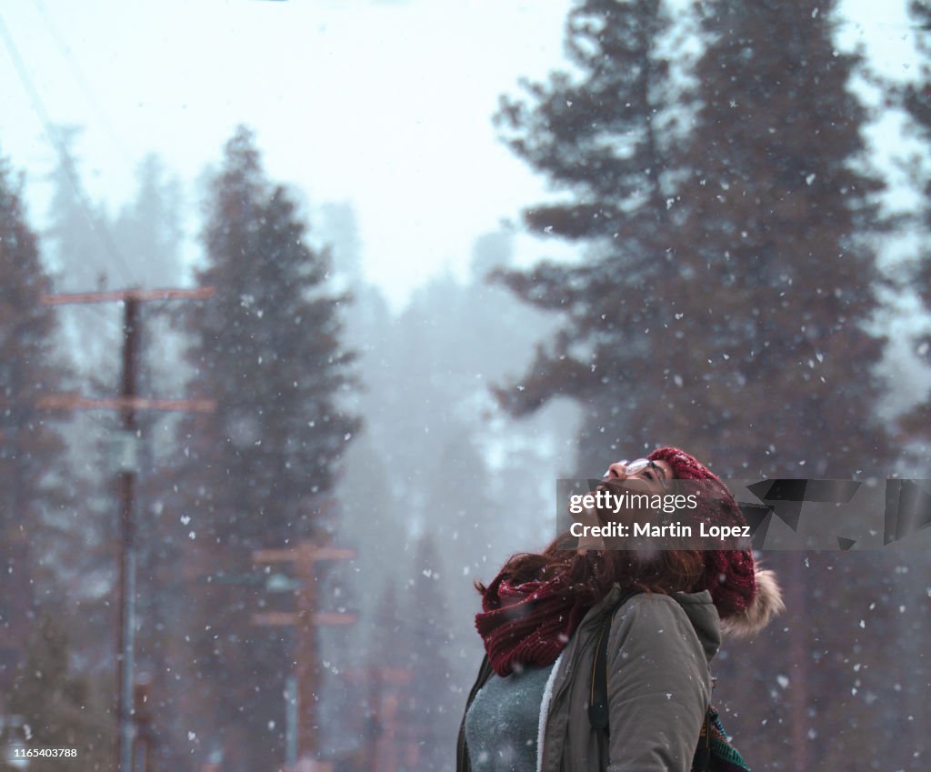 Woman enjoys the snow