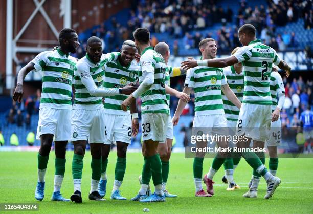 The Celtic team celebrate at the final whistle as they beat Rangers 2-0 during the Ladbrokes Premiership match between Rangers and Celtic at Ibrox...