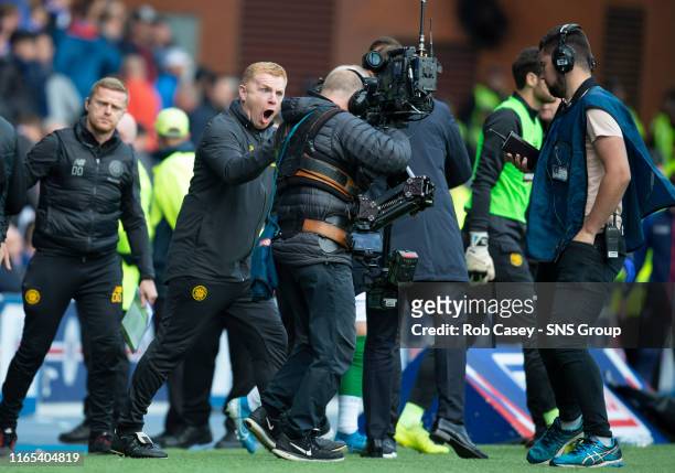 Celtic manager Neil Lennon celebrates down the lens of the Sky Sports camera during the Ladbrokes Premier match between Rangers and Celtic at Ibrox...