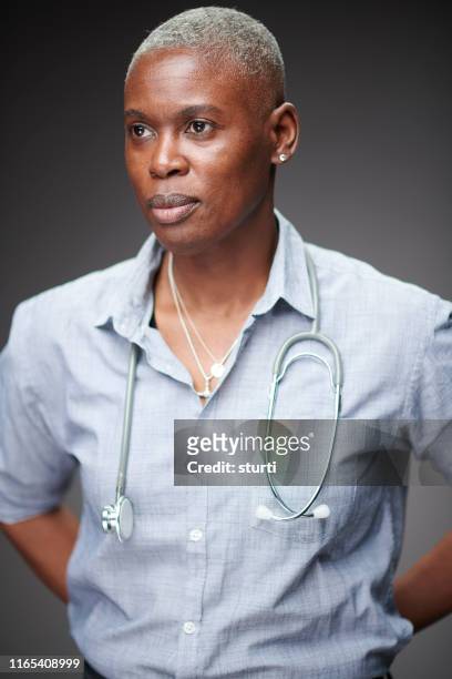 female doctor portrait - woman black shirt stock pictures, royalty-free photos & images