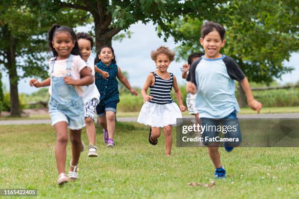 Playing Outside In Spring Children Playing Outside In Spring Photos and Premium High Res Pictures ...