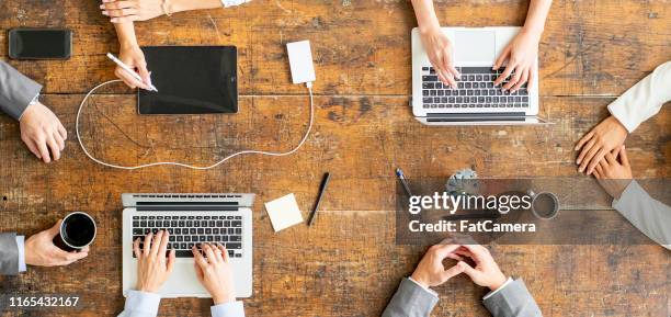 business team working together - conference table stock pictures, royalty-free photos & images