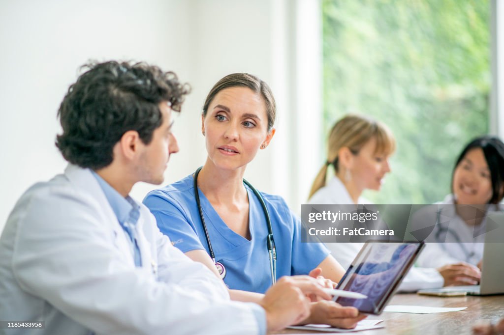 Doctors Learn Doctors Learning And Working Together High-Res Stock Photo - Getty Images