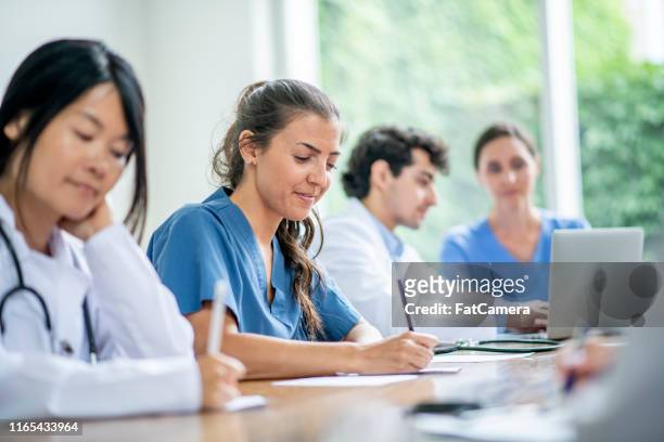 doctors learning and working together - medical education stock pictures, royalty-free photos & images
