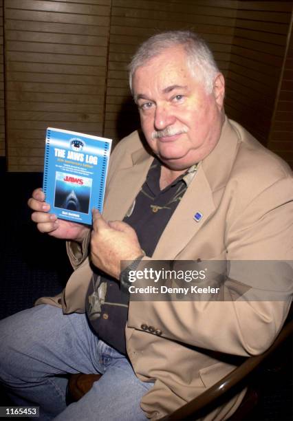 Author Carl Gottlieb poses with his book "The Jaws Log: Twenty-Fifth Anniversary Edition" during the booksigning October 2, 2001 at Barnes & Noble...