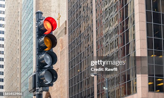 Red traffic lights for cars, office buildings background, Chicago city, Illinois Red traffic lights for cars, office buildings background, Chicago city, Illinois