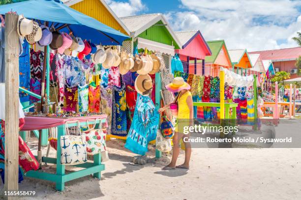 woman at souvenir market, long bay beach, antigua - dominikanische republik stock-fotos und bilder