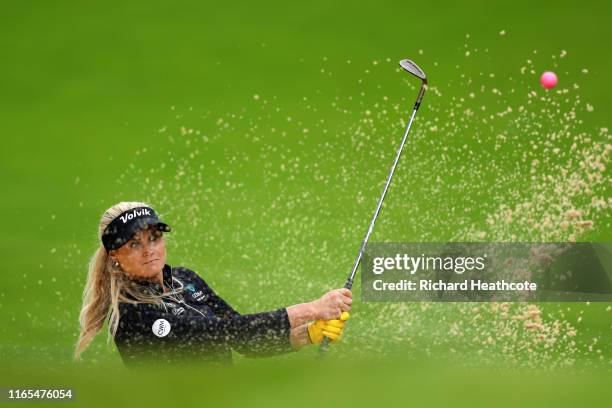 Carly Booth of Scotland plays out of a bunker on the third during Day One of the AIG Women's British Open at Woburn Golf Club on August 01, 2019 in...