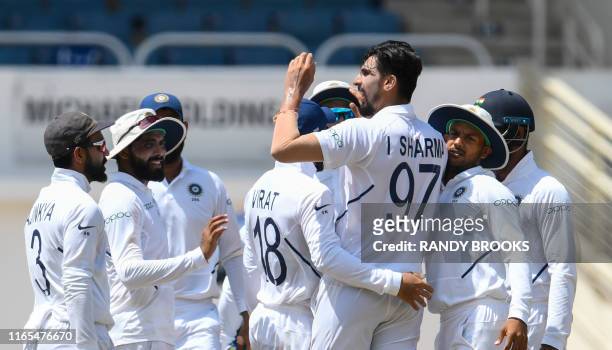 Ishant Sharma of India celebrates the dismissal of Jahmar Hamilton of West Indies during day 3 of the 2nd Test between West Indies and India at...