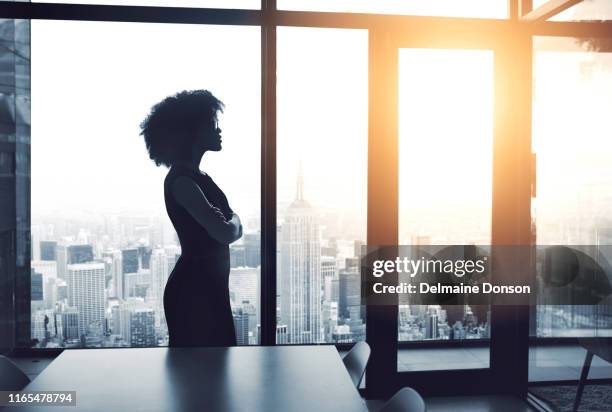 this city is mine to conquer - black woman in silhouette stock pictures, royalty-free photos & images