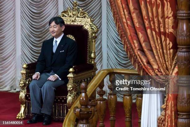Japan's Emperor Naruhito sits before declaring the opening of an extraordinary session of the parliament on August 1, 2019 in Tokyo, Japan. Emperor...