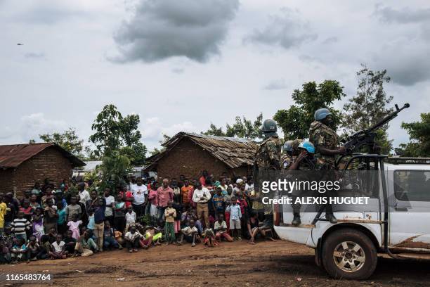 United Nations peacekeepers wait for the arrival of the UN secretary-general at an Ebola treatment centre in Mangina, North Kivu province, on...