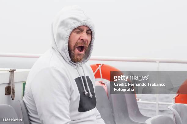 yawning man - winter illness stock pictures, royalty-free photos & images