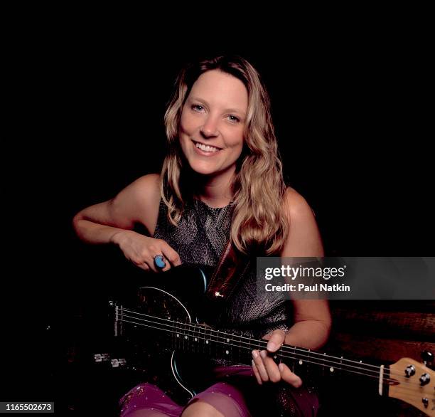 Portrait of American Blues musician Susan Tedeschi as she poses, with her guitar, backstage at the Rosemont Theater, Rosemont, Illinois, September 3,...