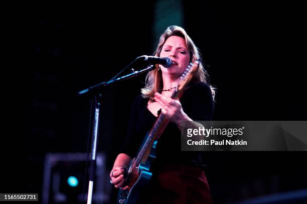 American Blues musician Susan Tedeschi plays guitar as she performs onstage during the Farm Aid benefit concert, Mannasas, Virginia, September 12,...