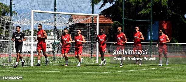 Joe Gomez, Adam Lallana, Harry Wilson, Naby Keita, Fabinho, Dejan Lovren and Mohamed Salah of Liverpool during a training session on August 01, 2019...