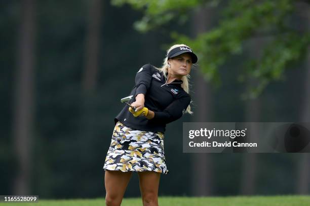 Carly Booth of Scotland plays her second shot on the third hole during Day One of the AIG Women's British Open on the Marquess Course at Woburn Golf...