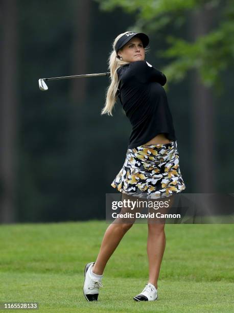 Carly Booth of Scotland plays her second shot on the third hole during Day One of the AIG Women's British Open on the Marquess Course at Woburn Golf...