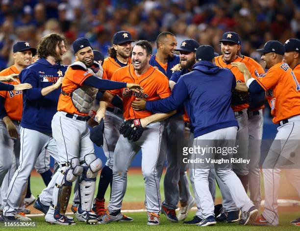 Justin Verlander of the Houston Astros celebrates with teammates after throwing a no hitter at the end of the ninth inning during a MLB game against...