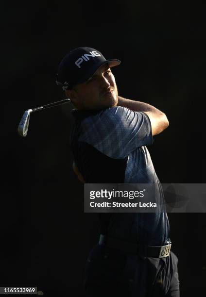 Austin Cook hits a tee shot on the 12th hole during the first round of the Wyndham Championship at Sedgefield Country Club on August 01, 2019 in...