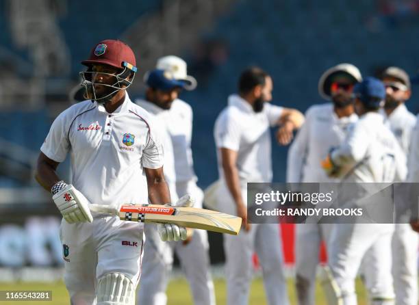 John Campbell of West Indies walks off the field after being dismissed by Mohammed Shami of India during day 3 of the 2nd Test between West Indies...