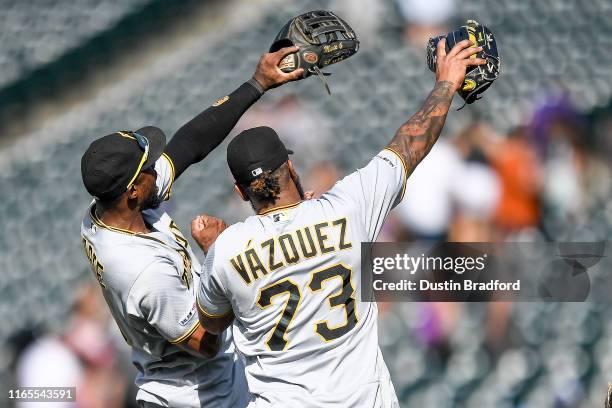 Starling Marte and Felipe Vazquez of the Pittsburgh Pirates celebrate after a 6-2 win over the Colorado Rockies at Coors Field on September 1, 2019...