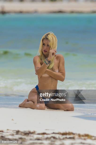 Model is seen during a photoshoot on the beach on September 1, 2019 in Cancun, Mexico.