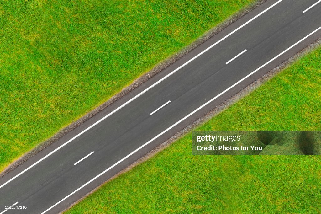 The road in the middle of the field./aerial shot