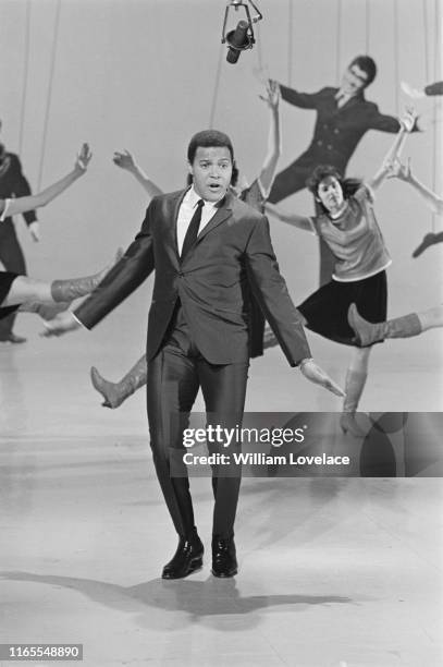 American rock 'n roll singer and dancer Chubby Checker 'doing the Freddie' on a television show, UK, 7th April 1965.