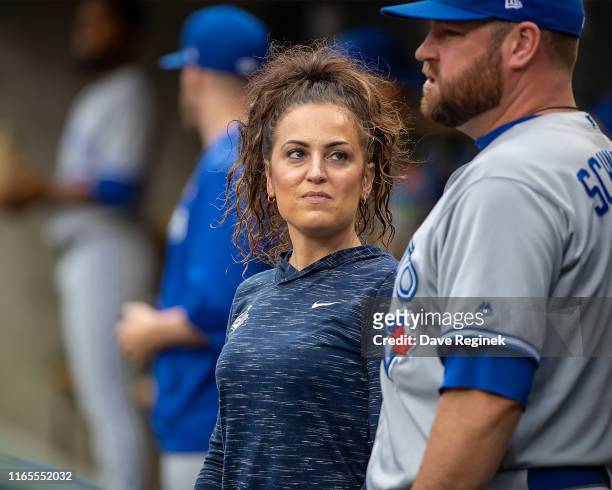 Head athletic trainer Nikki Huffman of the Toronto Blue Jays talks to John Schneider of the Blue Jays during a MLB game against the Detroit Tigers at...