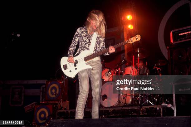 American Alternative Rock musician Kim Gordon, of the group Sonic Youth, plays bass guitar as she performs onstage at the Rosemont Horizon, Rosemont,...