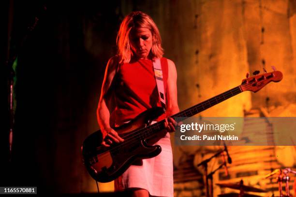 American Alternative Rock musician Kim Gordon, of the group Sonic Youth, plays bass guitar as she performs onstage at the World Music Theatre, Tinley...
