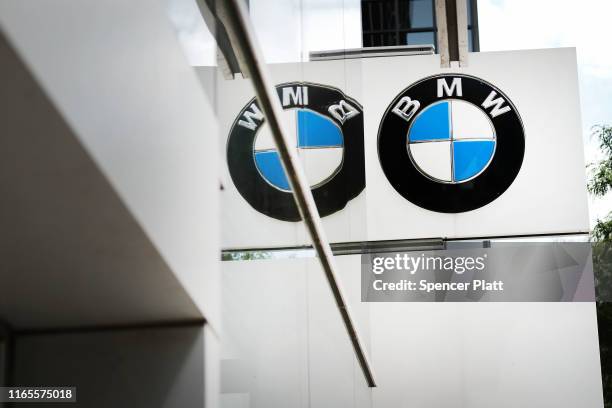 Logo is displayed at a BMW showroom in Manhattan on August 01, 2019 in New York City. Blaming slowing sales in the U.S., China and Europe, BMW...