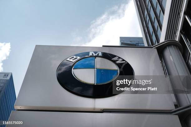 Logo is displayed at a BMW showroom in Manhattan on August 01, 2019 in New York City. Blaming slowing sales in the U.S., China and Europe, BMW...