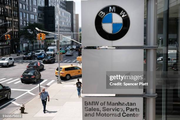 Logo is displayed at a BMW showroom in Manhattan on August 01, 2019 in New York City. Blaming slowing sales in the U.S., China and Europe, BMW...