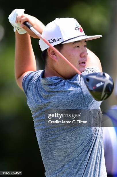 Sungjae Im of South Korea plays his shot from the 11th tee during the first round of the Wyndham Championship at Sedgefield Country Club on August...