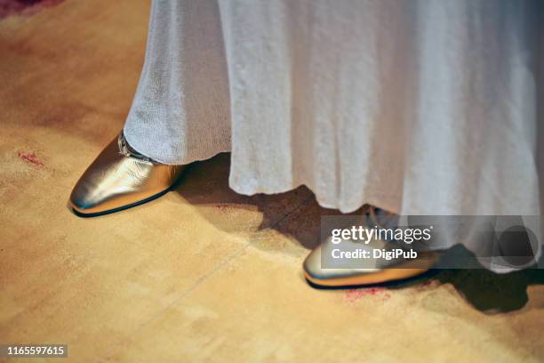 gold colored leather shoes under skirt - metallic skirt stock pictures, royalty-free photos & images