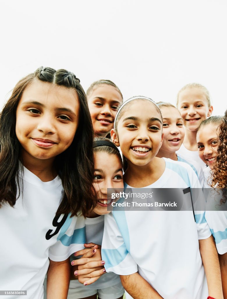 Portrait of smiling young female soccer players
