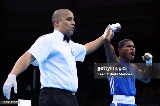 Rodrigo Marte de la Rosa of Dominican Republic celebrates after defeating Yosvani Veitia Soto of Cuba in men´s Boxing Fly Final Bout on Day 6 of Lima...