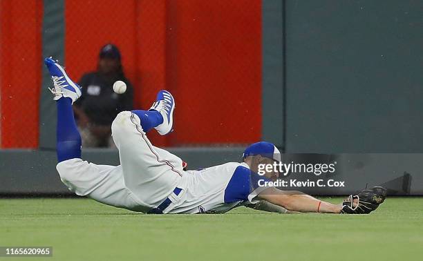 Ender Inciarte of the Atlanta Braves dives in a failed attempt to catch a double hit by Joey Votto of the Cincinnati Reds in the sixth inning at...