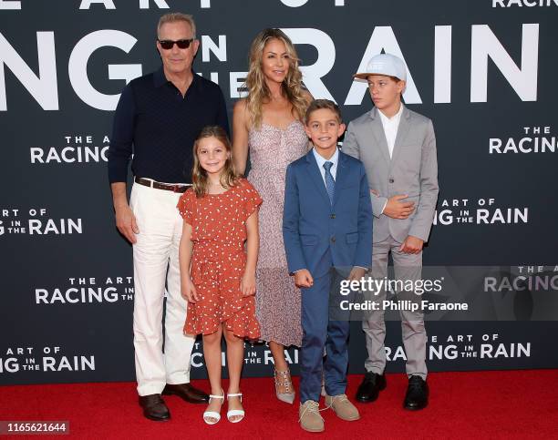 Kevin Costner and Christine Baumgartner attends the Premiere Of 20th Century Fox's "The Art Of Racing In The Rain" at El Capitan Theatre on August...