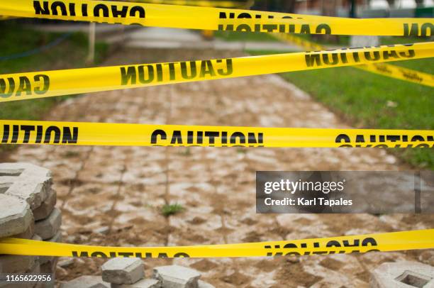 yellow tape caution sign outdoor during day time - cordon tape stock pictures, royalty-free photos & images