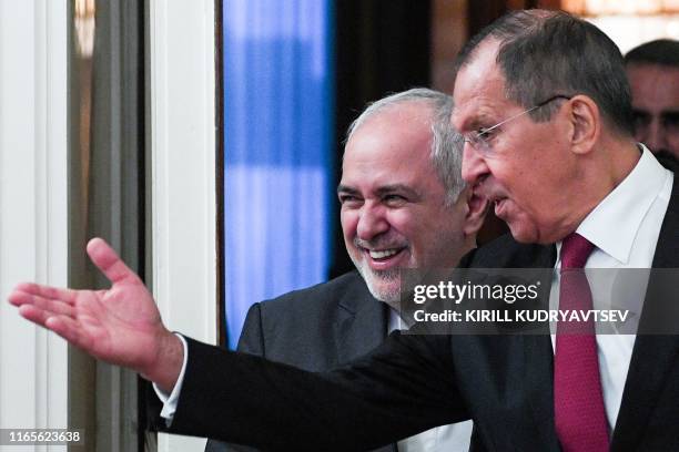 Russian Foreign Minister Sergei Lavrov welcomes his Iranian counterpart Mohammad Javad Zarif during a meeting in Moscow on September 2, 2019.